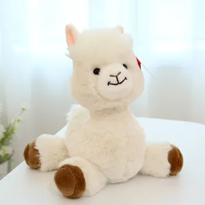 Cute white alpaca plush toy detail, soft fluffy stuffed animal doll with brown hooves.