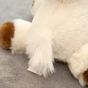 Alpaca plush toy detail close-up showing soft white fluffy fur and brown hooves craftsmanship.