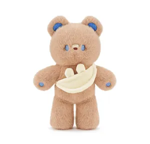 Detailed close-up shot of the cute brown plush bear toy with blue details and small bunny bag.