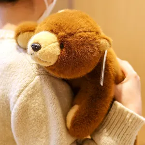 Close-up detail of soft brown plush teddy bear toy, cozy companion for hugging and sleeping.