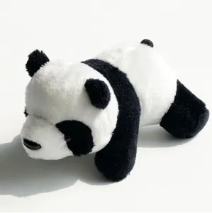 Cute plush panda toy detail shot, soft stuffed animal figurine showing fluffy texture.
