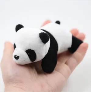 Cute panda plush pendant close-up, soft miniature stuffed toy for bag accessory DIY decor.
