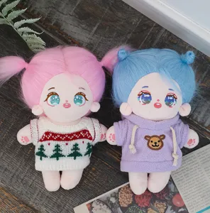 Plush cotton doll set with colorful hair and cute knitted sweater or hoodie, detail view.