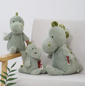 Corduroy dinosaur plush toy detailed view, soft stuffed animal doll for comforting kids and home decor.