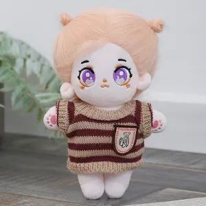 Cute cotton plush doll with blonde fluffy hair and purple eyes wearing a striped knitted sweater.