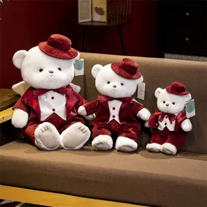 Cute white plush teddy bear in red velvet suit and hat, soft stuffed animal gift set.