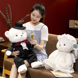 Detailed shot of a couple wedding teddy bears plush toy set, soft white groom and bride dolls.