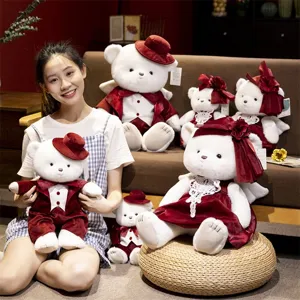 Charming couple angel teddy bear plush toy detail scene with soft fabric and red wedding dress.