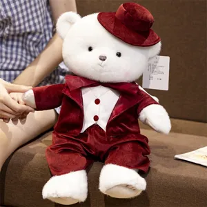 Cute white plush teddy bear toy wearing a red velvet suit and hat, perfect gift for lovers.