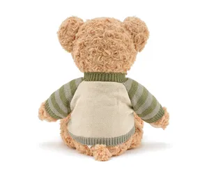Detailed back view of a cute plush teddy bear wearing a vintage green and beige knitted sweater.