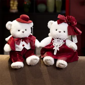Cute couple teddy bears plush toys in wedding red dress and suit, perfect romantic gift.