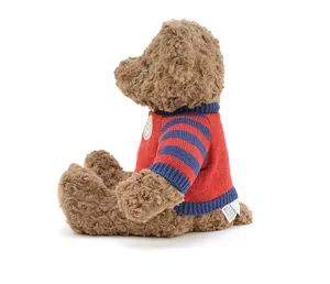 Cute brown plush teddy bear wearing a classic red and blue striped knitted sweater.