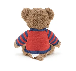 Detailed back view of a cute brown plush teddy bear wearing a cozy red and blue striped sweater.