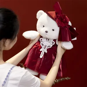 Plush bear toy stuffed animal in red dress with elegant hat, detailed doll for gift