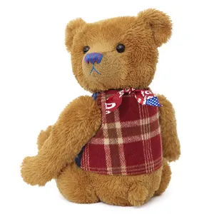 Orsetto di peluche snodato con gilet a quadri e nastro rosso, regalo perfetto per San Valentino.