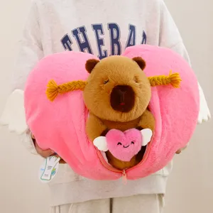 Cute capybara plush toy with angel heart pillow, soft stuffed animal gift for girls.