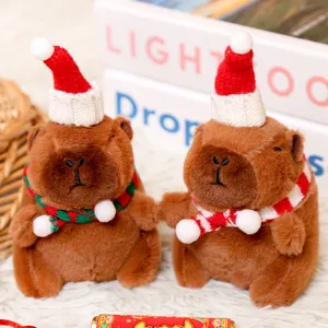 Cute Christmas capybara plush toy pendant with santa hat and scarf, detail shot for holiday decor.