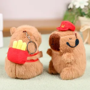 Capybara plush toy keychain detail, cute stuffed animal with french fries backpack.