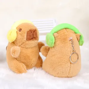 Cute capybara plush keychain with headphones, soft animal bag charm and toy pendant for gifts.