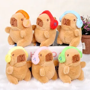 Cute capybara plush toy pendant with colorful earmuffs, soft stuffed animal keychain charm.