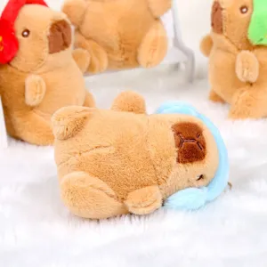 Cute capybara plush toy keychain with headphones, soft animal doll bag pendant for gifts.