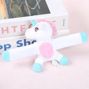Plush unicorn slap bracelet toy detail view, cute white and pink animal design for kids gift.