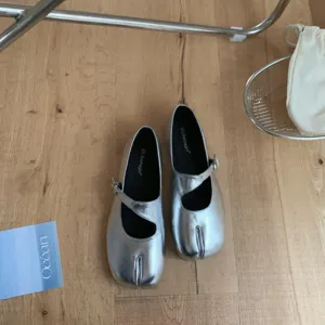 Silver split-toe Mary Jane flat shoes, trendy metallic designer casual footwear.