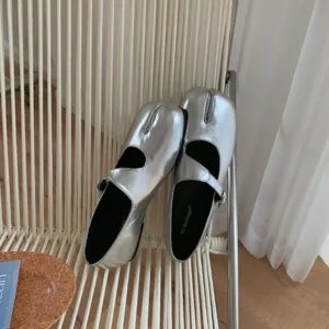 Silver split-toe Mary Jane flats, chic Tabi flat shoes detail shot showcasing metallic finish.