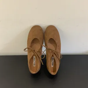 Women brown suede lace-up ballet flats casual soft comfortable flat shoes detail view.