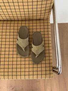 Women thick sole suede thong sandals casual beach flip-flops detail view showing textured insole.