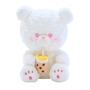 Cute white plush bear holding boba tea cup, soft stuffed toy for kids and graduation gift.