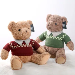 Cute plush teddy bear toy with retro sweater, soft stuffed doll for kids and gift collection.
