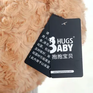 Detail view of cute teddy bear plush toy tag and soft brown fur texture, perfect gift.