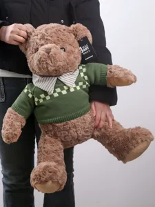 Cute brown teddy bear plush toy wearing retro green sweater, soft huggable doll gift for kids.
