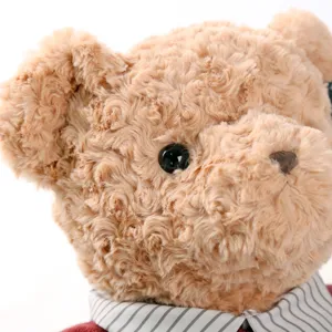 Close-up detail of cute curly plush teddy bear wearing a vintage striped collar sweater.