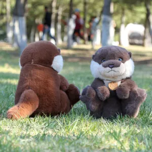 Close-up detail of cute simulation otter plush toy showing soft brown fur and realistic cute face.