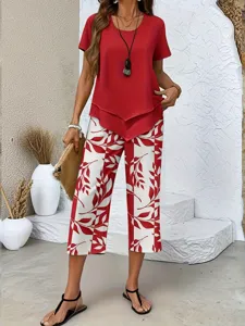 Detailed view of the elegant red short sleeve top and red leaf print pants two-piece set.