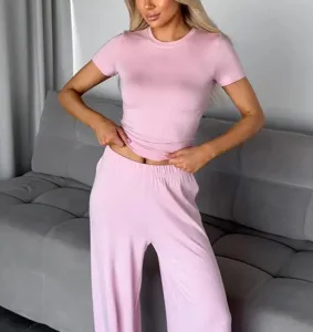 Women pink knit short sleeve t-shirt and wide leg pants two piece casual loungewear set.