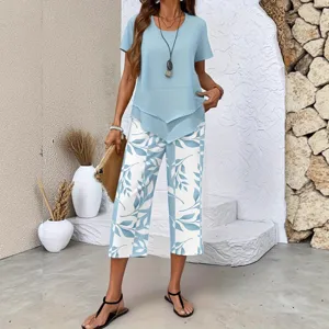 Women's chic printed two-piece outfit featuring a light blue top and leaf pattern pants.