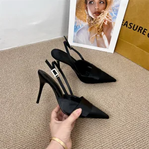 Detailed view of elegant black satin pointed toe slingback stiletto high heels for women.