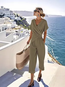 Summer fashion solid color irregular short sleeve jumpsuit for women, elegant casual wear.