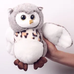 Soft gray owl plush toy close up detail showing big glitter eyes and cute design.