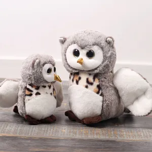 Cute owl plush toy detail shot, soft stuffed animal doll, perfect for kids room decor and gift.