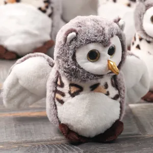Close-up detail of the cute fluffy owl plush toy, soft texture and detailed design.