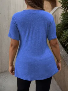 Back view detail of women solid blue short sleeve casual t-shirt in outdoor street setting.