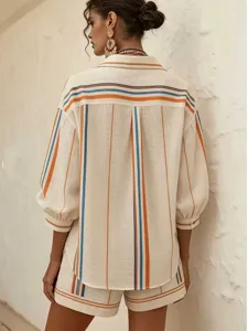 Back detail view of the elegant striped shirt and shorts matching set, showing back pleats.