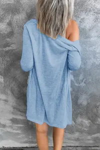 Detailed back view of women's casual solid color long sleeve open front cardigan sweater.