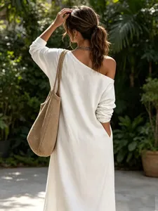 Detail view of a women's casual loose off-shoulder linen blend midi dress with pocket.