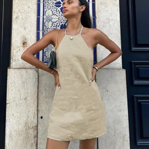 Details of the backless halter beige linen summer dress, elegant style with a nice drape.