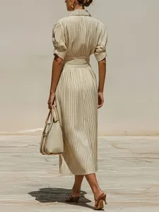 Elegant striped shirt dress for women with V-neck, short sleeves, and button details.